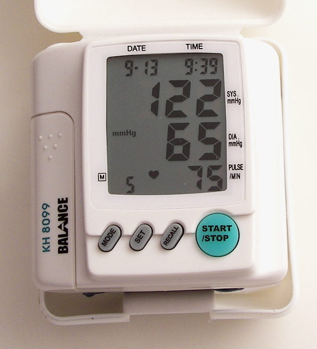 Modern digital blood pressure monitor on a consulting room table