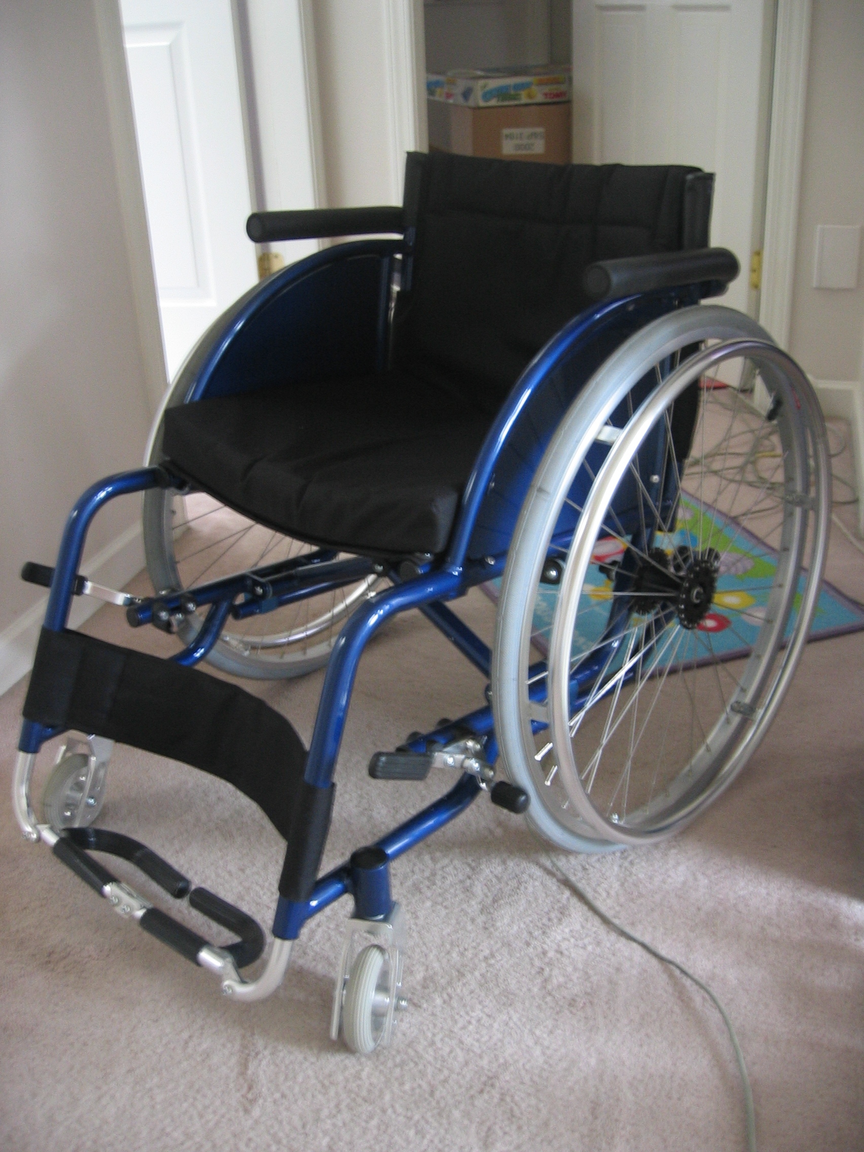 Modern high-quality lightweight wheelchair in a clinic corridor